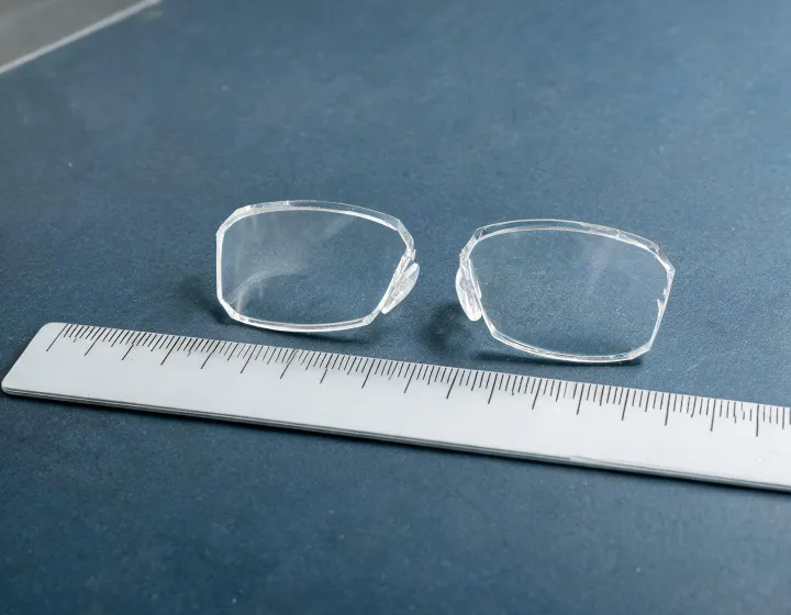 Prism glasses for double vision on an optical bench, illustration only